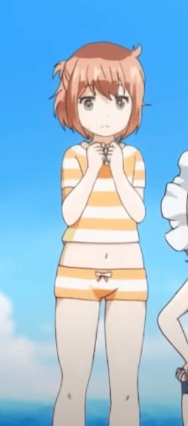 Megumu in a swimsuit standing on the beach